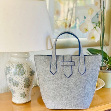 Grey Conscious Chic Handbag with contrast blue lining  made from recycled plastic bottles 