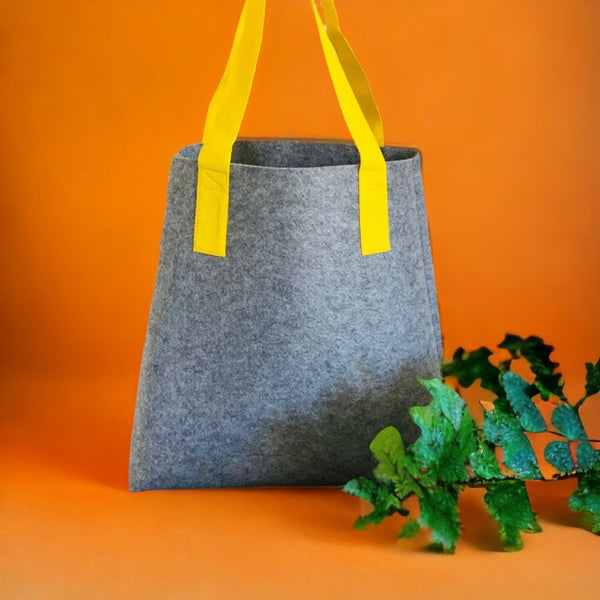 grey felt shopper bag with yellow shoulder straps 