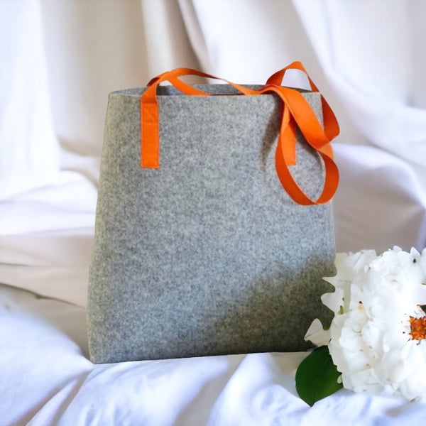 grey felt shopper bag with orange shoulder straps 