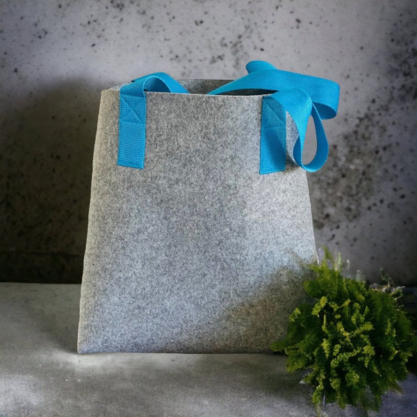 grey felt shopper bag with turquoise shoulder straps  