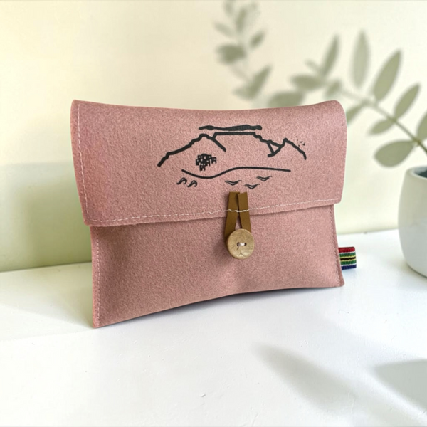 Soft pink pure wool felt pouch with black Cape Town Table Mountain print, wooden button and leather loop closure
