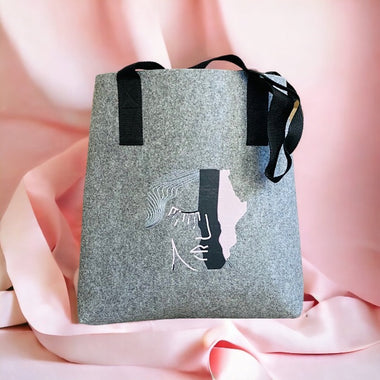 Shopper Tote Bag made from recycled plastic bottles with abstract face print 